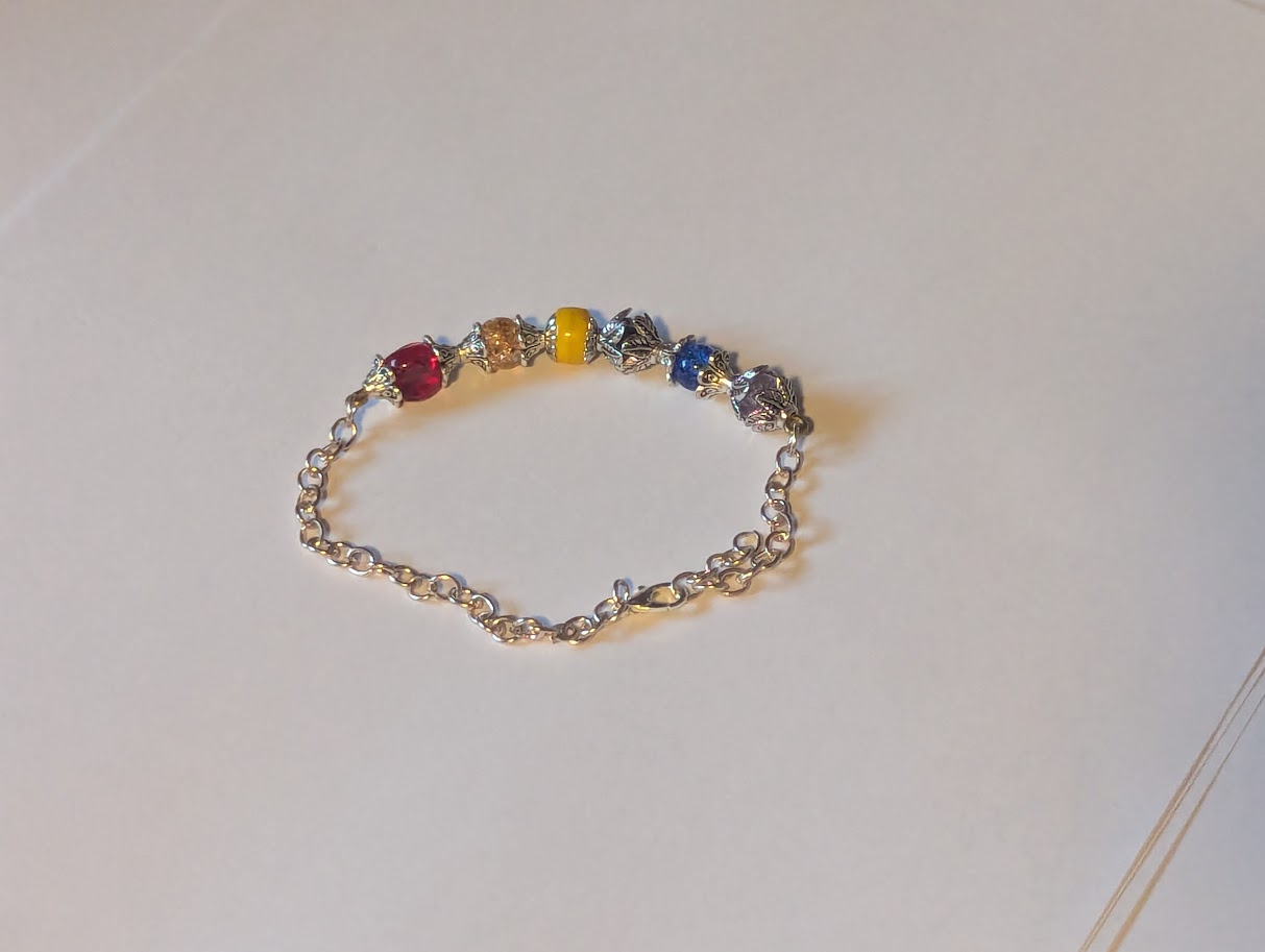 Rainbow beads on a piece of wire connected to chain